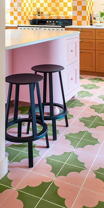Pink and green cement tiles on kitchen floor